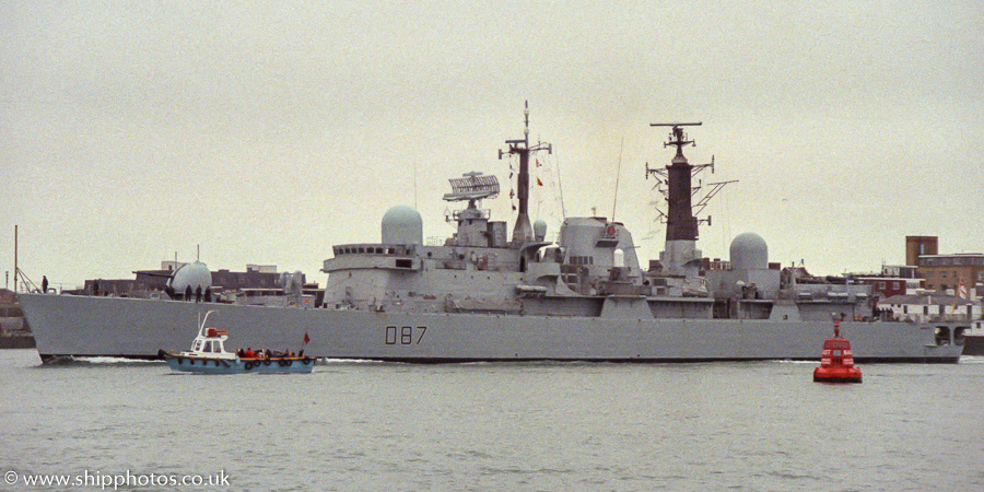 Photograph of the vessel HMS Newcastle pictured entering Portsmouth Harbour on 4th March 1989