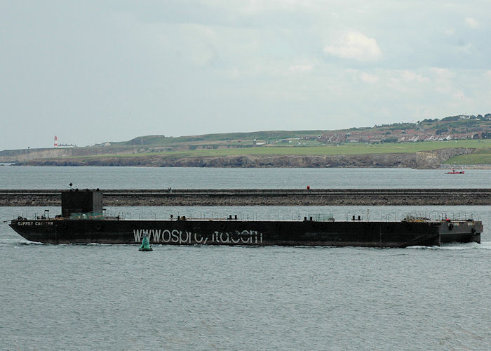 Photograph of the vessel  Osprey Carrier pictured departing the River Tyne under tow on 10th August 2010