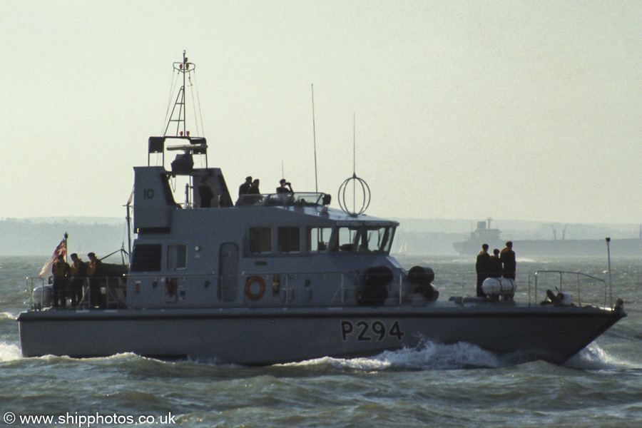 Photograph of the vessel HMS Trumpeter pictured entering Portsmouth Harbour on 11th November 1989